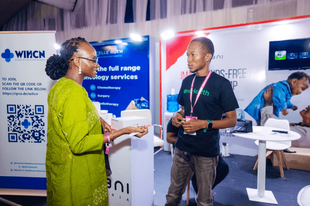 Dr Faith in a professional conversation at a health conference